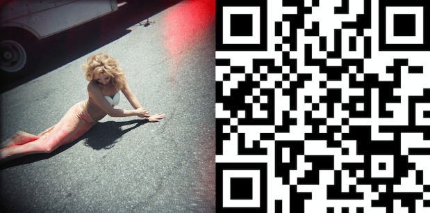 foto of woman on sidewalk next to QR code